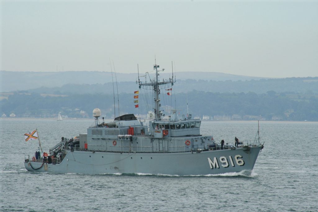 The Belgian minesweeper BNS Bellis at Spithead, inbound to Portsmouth Naval Base on 09 July 2010 in company with the Belgian minesweeper support ship BNS Godetia and the minesweeper BNS Primula. 