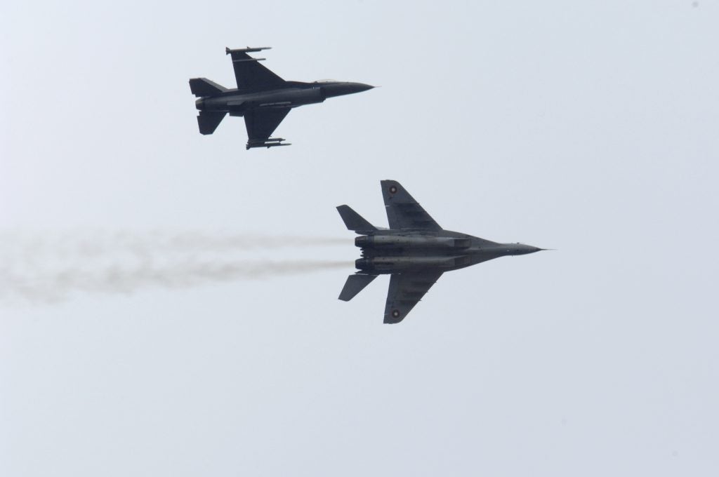 Bulgarian Air Force MiG-29 (bottom), joined by a U.S. Air Force F-16 (top) during exercise Nickel Javelin over Bulgaria, 10 November 2008