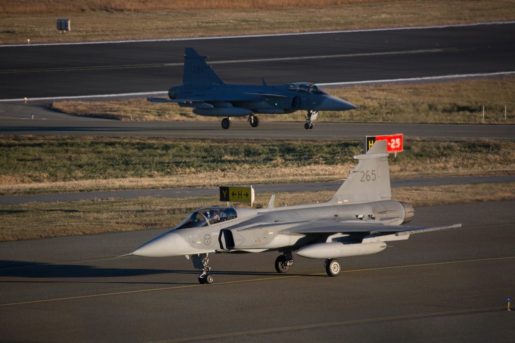 Two Saab Gripen C/D, contender in the program, taxiing at Bodø Air Base in Norway during exercise Trident Juncture 2018. (OR-8 Sebastien Raffin) 