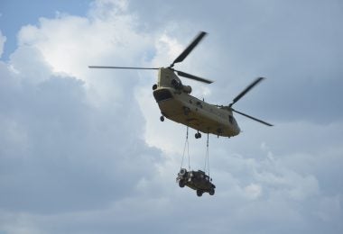 A U.S. CH-47F Chinook Helicopter assigned to Bravo Company, 1st Battalion, 214th Aviation Regiment, 12th Combat Aviation Brigade conducts sling load procedures at the 7th Army Training Command's Grafenwoehr Training Area, Germany, July 26, 2018. (U.S. Army photo by Christoph Koppers)