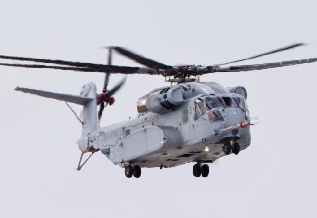 A CH-53K King Stallion aircraft, left, prepares to land at Sikorsky Aircraft Corporation, Jupiter, Fla., March 8, 2016. The CH-53K will replace the CH-53E Super Stallion aircraft, currently used by the Marine Corps. (U.S. Marine Corps photo by Staff Sgt. Gabriela Garcia/Released)