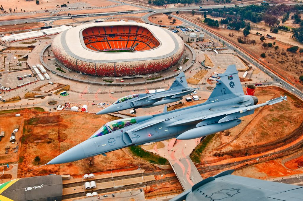 A 2-ship formation of SAAF Gripens over the First National Bank Stadium in Johannesburg, South Africa. (Frans Dely/Saab AB)