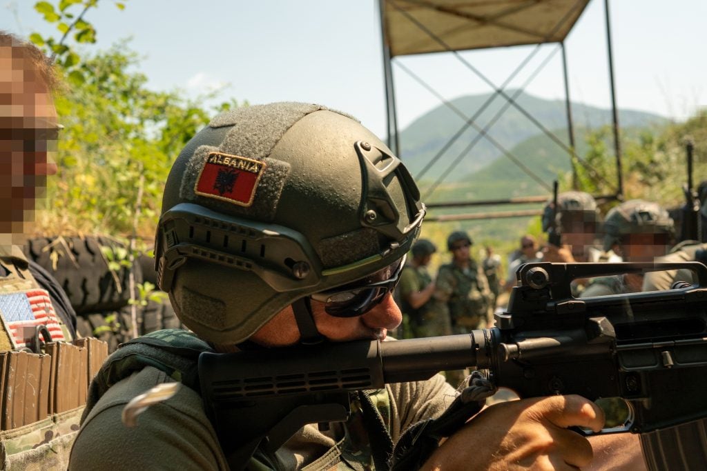 A U.S. Army Green Beret assigned to 10th Special Forces Group observes Close-Quarter-Battle drills conducted by the Albanian Special Forces, Albania, July 21, 2021. Joint Combined Exchange Training enhances interoperability with Partner Nations and strengthens military readiness, teamwork and joint confidence while promoting peace and stability in Europe. (U.S. Marine Corps photo by Sgt. Devin J. Andrews)