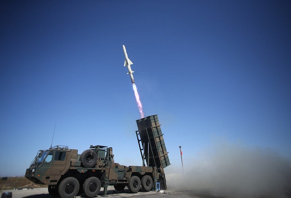 A current-generation Type 12 missile system fires