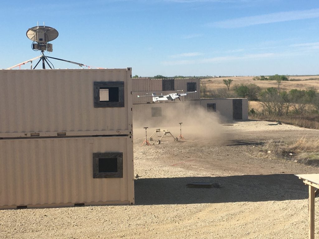 Soldiers from the 1st Armored Brigade Combat Team, 1st Infantry Division, execute the air vehicle control handoff capabilities with the AeroVironment, Inc's JUMP 20 in a simulated urban environment during the Army's FTUAS capability assessment, at Fort Riley, Kansas. The landing and subsequent takeoff showed the ability of the UAS to take off and land in a confined area without the need for a runway. (Photo by Jonathan Koester)