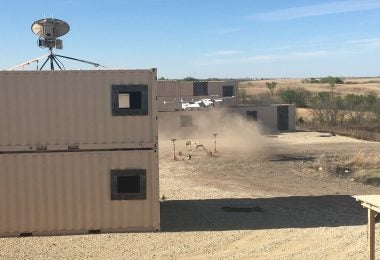 Soldiers from the 1st Armored Brigade Combat Team, 1st Infantry Division, execute the air vehicle control handoff capabilities with the AeroVironment, Inc's JUMP 20 in a simulated urban environment during the Army's FTUAS capability assessment, at Fort Riley, Kansas. The landing and subsequent takeoff showed the ability of the UAS to take off and land in a confined area without the need for a runway. (Photo by Jonathan Koester)