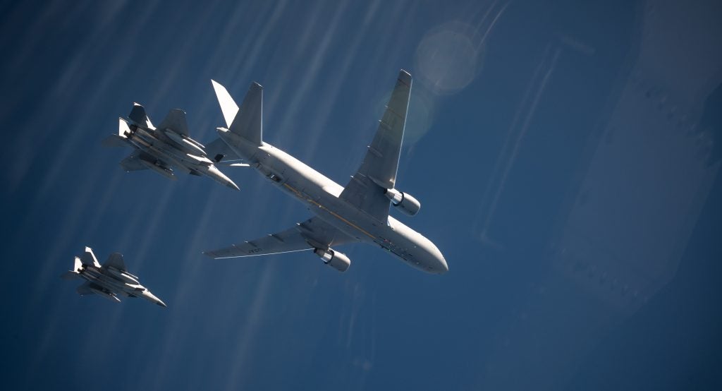 A U.S. Air Force KC-46A Pegasus assigned to the 22nd Air Refueling Wing at McConnell Air Force Base, Kansas refuels U.S. Air Force F-15C Eagle from the 67th Fighter Squadron while participating in Exercise WestPac Rumrunner, out of Kadena Air Base, Japan, Oct. 16, 2020. This was the first time the 18th Wing conducted KC-46 air refueling operations of Kadena Air Base F-15s. (U.S. Air Force photo by Tech. Sgt. Daniel E. Fernandez)