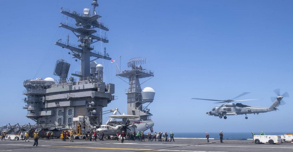 220614-N-DU622-1028 PACIFIC OCEAN (June 14, 2022) An MH-60R Sea Hawk helicopter, from the "Battlecats" of Helicopter Strike Maritime Squadron (HSM) 73, lifts off of the flight deck of the aircraft carrier USS Nimitz (CVN 68). Nimitz is underway in the U.S. 3rd Fleet area of operations. (U.S. Navy photo by Mass Communication Specialist 3rd Class Justin McTaggart)