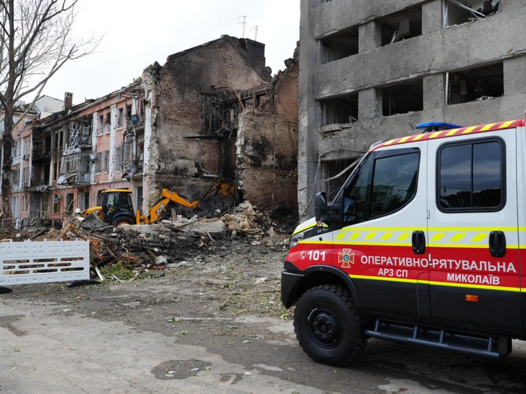 Ukraine State Emergency Service firefighters conducting search and rescue work on July 20 at a building in Mykolaiv destroyed in a Russian attack the night before (State Emergency Service of Ukraine)