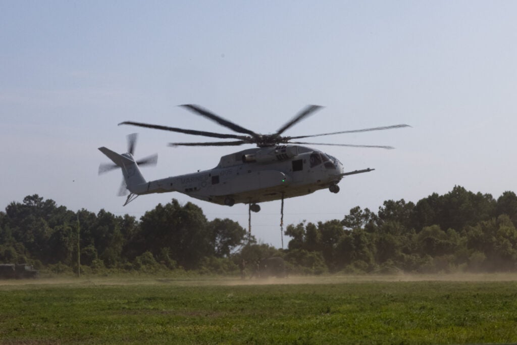 U.S. Marines with Marine Heavy Helicopter Squadron (HMH) 461 practice external lifts with a CH-53K King Stallion at Marine Corps Base Camp Lejeune, North Carolina, Aug. 15, 2023. HMH-461 took part in Large Scale Exercise 2023, a globally integrated exercise designed to refine how we synchronize maritime operations across multiple fleets in support of the joint force. The training was based on a progression of scenarios that will assess and refine modern warfare concepts. HMH-461 is a subordinate unit of 2nd Marine Aircraft Wing, the aviation combat element of II Marine Expeditionary Force. (U.S. Marine Corps photo by Lance Cpl. Orlanys Diaz Figueroa)