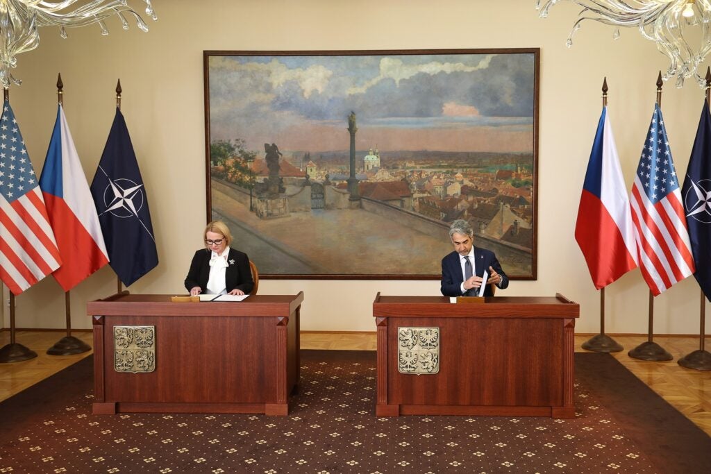 Czech Minister of Defence Jana Černochová (left) signs a memorandum of understanding on Czech F-35A procurement with U.S. Ambassador to the Czech Republic Bijan Sabet (Jan Schejbal/Czech Defense Ministry)