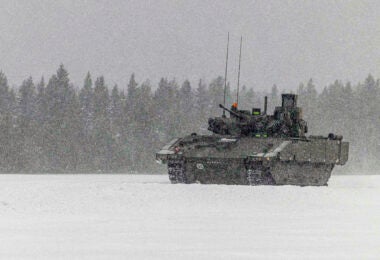 Pictured: The Ajax being tested in extreme weather conditions in Sweden. Ajax, the British Army’s new generation of armoured fighting vehicle, has been put through its paces during cold weather trials in Sweden. The Ajax’s all-weather capability was tested in the wintry conditions of frozen Lapland, where the temperatures regularly dropped to minus 30 Celsius. Service personnel from the Household Cavalry Regiment based in Wiltshire successfully and accurately illustrated the Ajax platforms capacity to operate in extremely cold weather and fire on the move. The soldiers from the Armoured Reconnaissance Regiment marked a significant milestone during the overseas trials, becoming the first Field Army crew to fire the Ajax at home or abroad. The combat vehicles mobility over difficult terrain and its high standard of protection, Intelligence, Surveillance, Target Acquisition and Reconnaissance (ISTAR) will provide a world-leading competitive advantage. Six variants of the Ajax family will allow the Army to operate in all weathers, 24 hours a day.