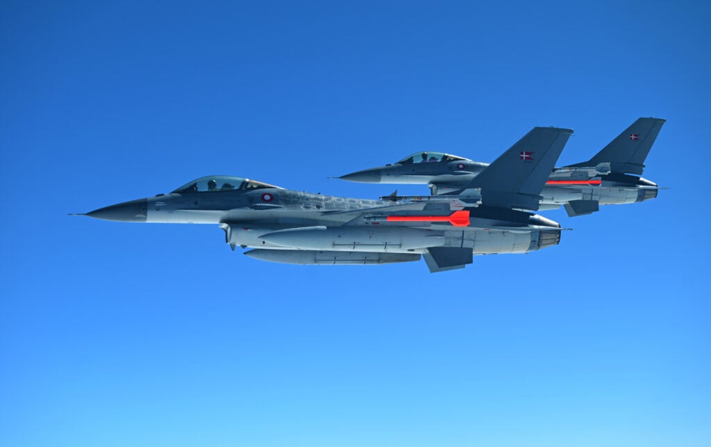 Two Danish F-16s integrate with a U.S. B-52H Stratofortress, assigned to the 2nd Bomb Wing, Barksdale Air Force Base, Louisiana, out of Morón Air Base, Spain, in support of Bomber Task Force Europe May 21, 2021. U.S. European Command enjoys mutually beneficial military cooperation with our Nordic allies and partner countries with respect to the Arctic region, constantly coordinating together on operations and exercises. (U.S. Air Force photo by Tech. Sgt. Jael Laborn)
