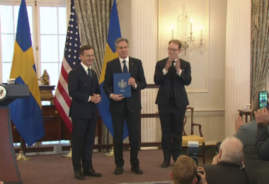 US Secretary of State Antony Blinken holds Sweden's NATO instrument of accession after it was handed over by Swedish Prime Minister Ulf Kristersson (State Department)